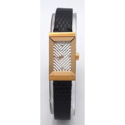 564 - A Gucci gold plated ladies quartz wristwatch with black leather strap, 14mm case diameter, in good w... 