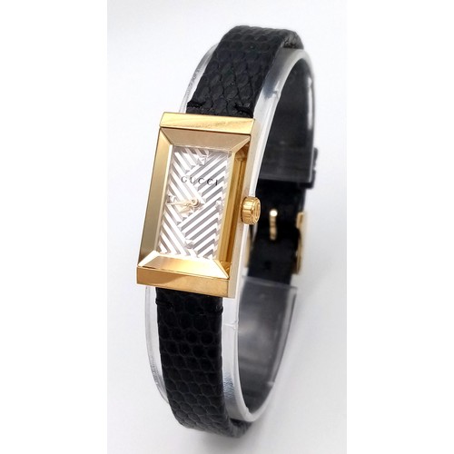 564 - A Gucci gold plated ladies quartz wristwatch with black leather strap, 14mm case diameter, in good w... 