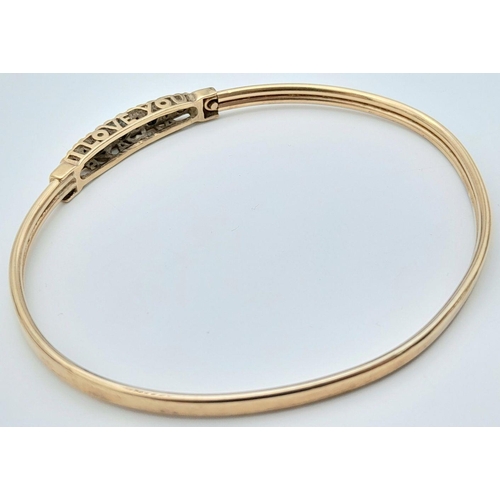 12 - A Fancy 9K Yellow Gold Sapphire and Diamond Bangle. Decorative 'I Love You Always' Message. 6.5cm in... 