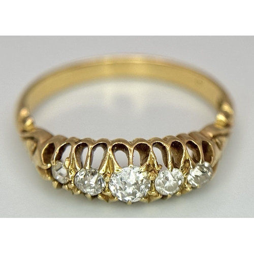 134 - An 18K Yellow Gold Five Diamond Ring. 0.60ctw of brilliant round cut diamonds. Size M. 2.9g total we... 