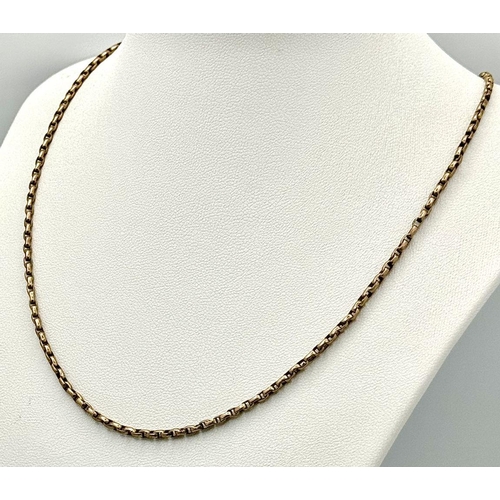 135 - An Antique 9K Yellow Gold Albert Chain. 44cm. 7.3g