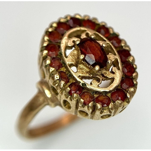 29 - An Vintage 9K Yellow Gold, Decorative Garnet Ring. Size N. 3.8g total weight.