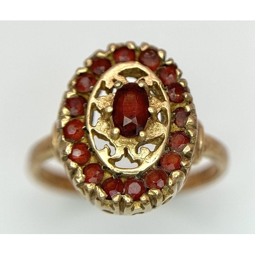 29 - An Vintage 9K Yellow Gold, Decorative Garnet Ring. Size N. 3.8g total weight.