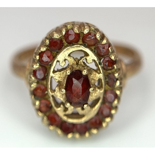 29 - An Vintage 9K Yellow Gold, Decorative Garnet Ring. Size N. 3.8g total weight.