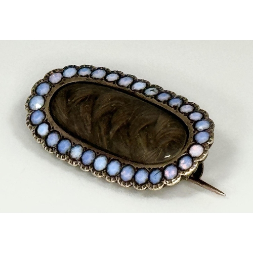 30 - An Antique Victorian 9K Gold and Opal Mourning Brooch. Hair memento with opal surround. 3cm. 4.5g to... 