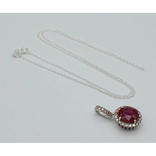 42 - A 3.75ct Oval Cut Ruby Pendant with Diamond Accents. Set in 925 Silver. Diamonds approx 0.50ctw. Com... 