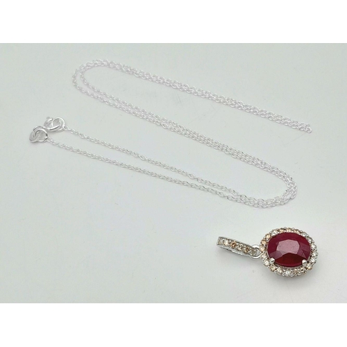 42 - A 3.75ct Oval Cut Ruby Pendant with Diamond Accents. Set in 925 Silver. Diamonds approx 0.50ctw. Com... 