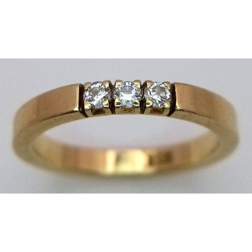 78 - A Stylish 14K Yellow Gold Diamond Trilogy Band Ring. Size I. 2.7g.