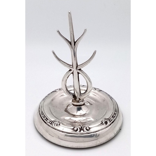 92 - An Antique 1914 Sterling Silver Tree Ring. Hallmarks for Birmingham 1914. Weighted base. 8cm tall. 6... 