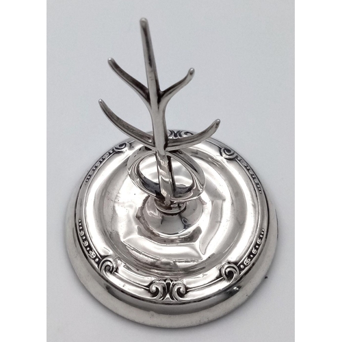 92 - An Antique 1914 Sterling Silver Tree Ring. Hallmarks for Birmingham 1914. Weighted base. 8cm tall. 6... 