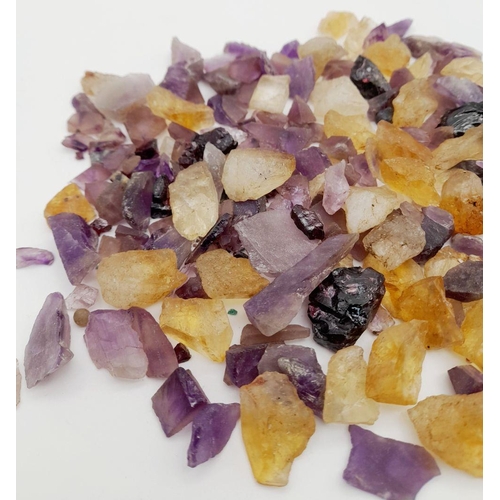 932 - A mixed lots of rough amethyst, ametrine, and quartz stones with a total weight of approximately 241... 