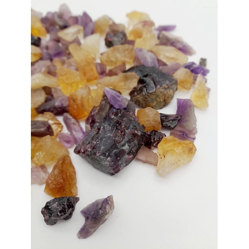 932 - A mixed lots of rough amethyst, ametrine, and quartz stones with a total weight of approximately 241... 