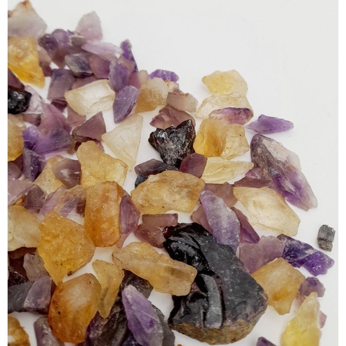932 - A mixed lots of rough amethyst, ametrine, and quartz stones with a total weight of approximately 241... 