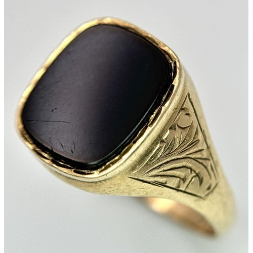 99 - A Vintage 9K Yellow Gold Black Onyx Signet Ring. Size R. 2.6g total weight.