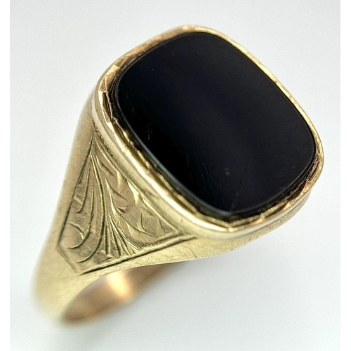 99 - A Vintage 9K Yellow Gold Black Onyx Signet Ring. Size R. 2.6g total weight.