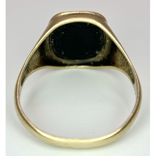 99 - A Vintage 9K Yellow Gold Black Onyx Signet Ring. Size R. 2.6g total weight.