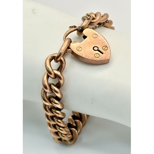 121 - A Vintage 9K Rose Gold Curb Link Bracelet with Heart Clasp. 
18cm. 16.4g.