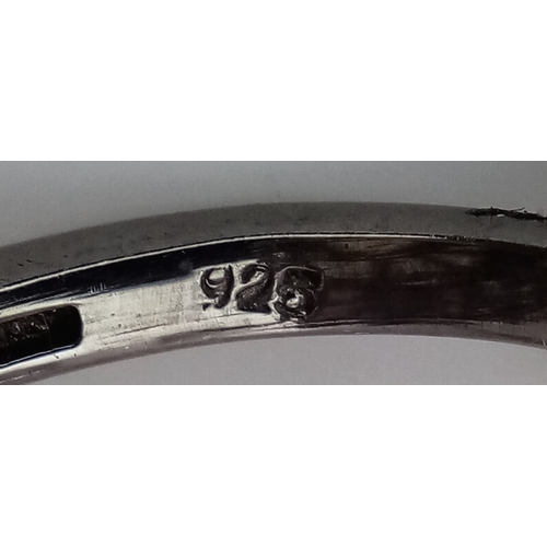 848 - A 925 sterling silver ring featuring a central opal stone surrounded by pink tourmaline stones. Ring... 