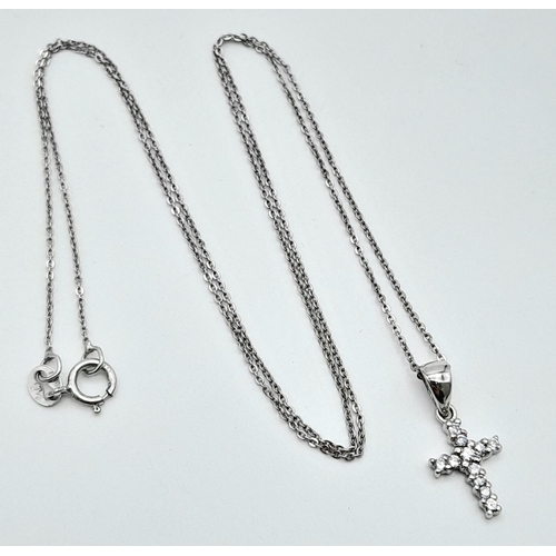 559 - An Italian 18K White Gold Necklace with a 9K gold Stone Set Cross Pendant. 40cm and 15mm. 1.25g tota... 