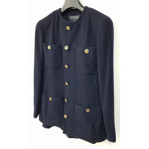 34 - A Gorgeous, Timeless Vintage Chanel Navy Wool Two Piece Suit. Gilded Chanel monogram buttons. Four e... 