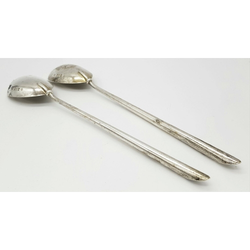 148 - A pair of antique London hallmarked 1902 silver salad servers featuring a sleek, timeless design. Ap... 