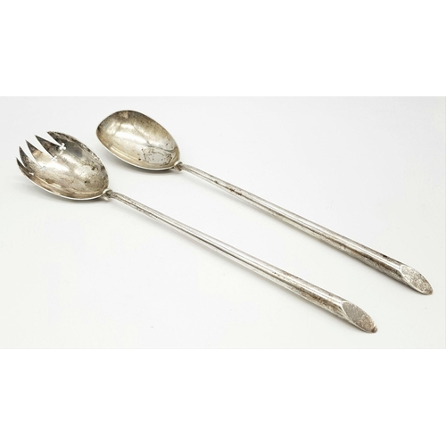 148 - A pair of antique London hallmarked 1902 silver salad servers featuring a sleek, timeless design. Ap... 