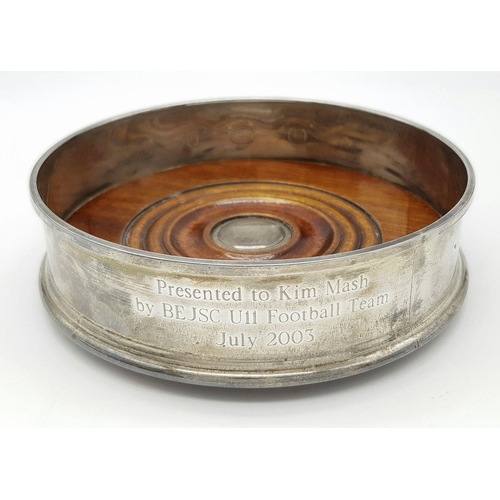 491 - A 925 sterling silver wine coaster featuring wooden detail and a felt-lined base. Engraved with 