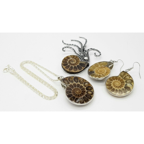 498 - An Ammonite Jewellery Suite: Comprising of necklace with pendant, brooch and earrings.