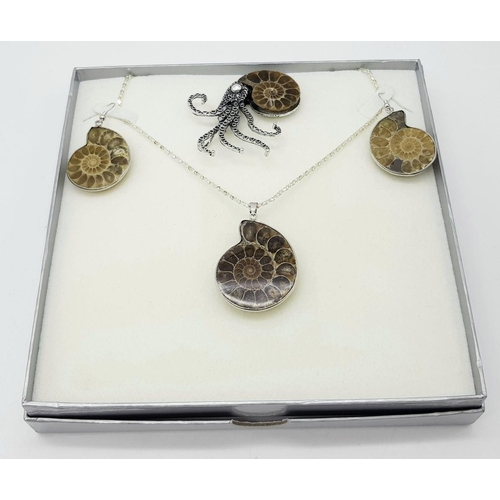 498 - An Ammonite Jewellery Suite: Comprising of necklace with pendant, brooch and earrings.