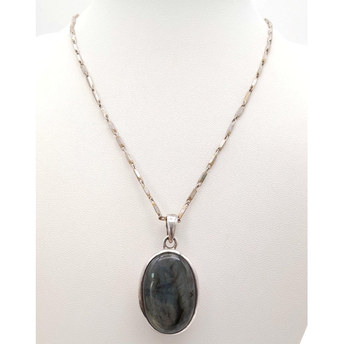 561 - A Vintage Silver and Rutilated Quartz Pendant on a Silver Chain. 42cm and 3cm. 21g