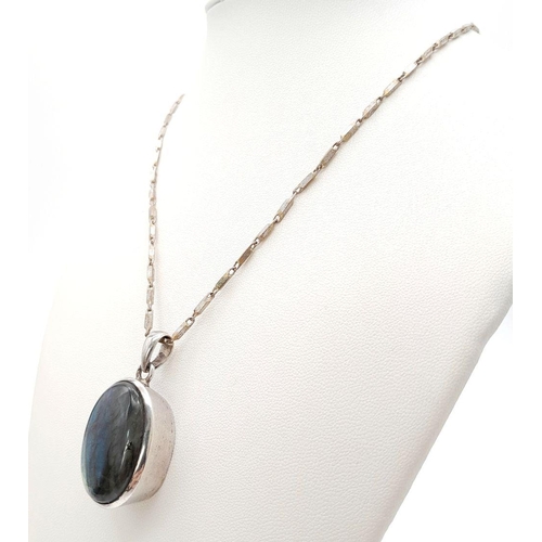 561 - A Vintage Silver and Rutilated Quartz Pendant on a Silver Chain. 42cm and 3cm. 21g