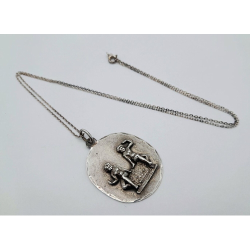 903 - A vintage Sterling Silver Cherubic Ornate Pendant with Sterling Silver Necklace. 50 and 4cm. 7.5g