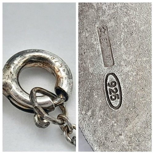 903 - A vintage Sterling Silver Cherubic Ornate Pendant with Sterling Silver Necklace. 50 and 4cm. 7.5g