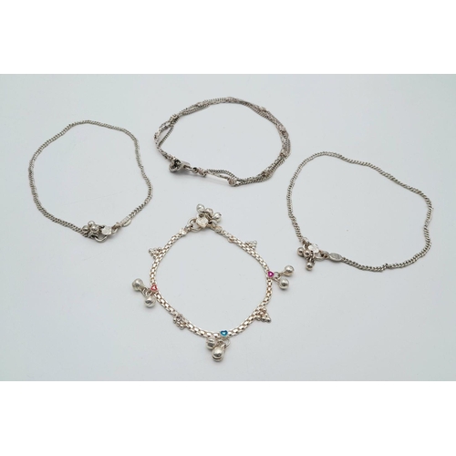 853 - Four Different Style Silver (tests as) Bracelets. 39g