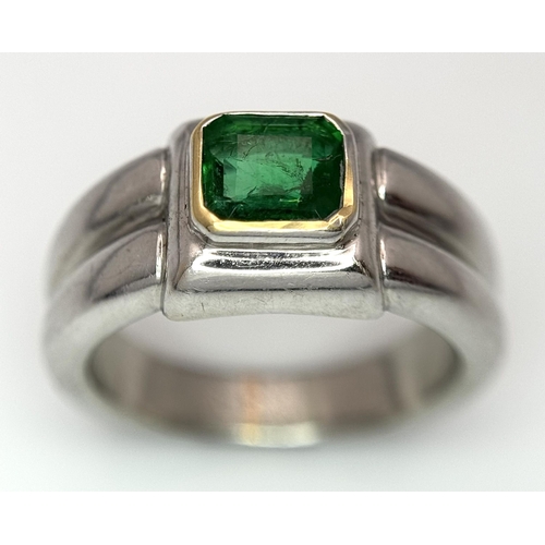 136 - A Princess Cut 0.75ct Mesmerising Emerald Set in a Platinum Ring. Size L 1/2. 14.6g total weight.