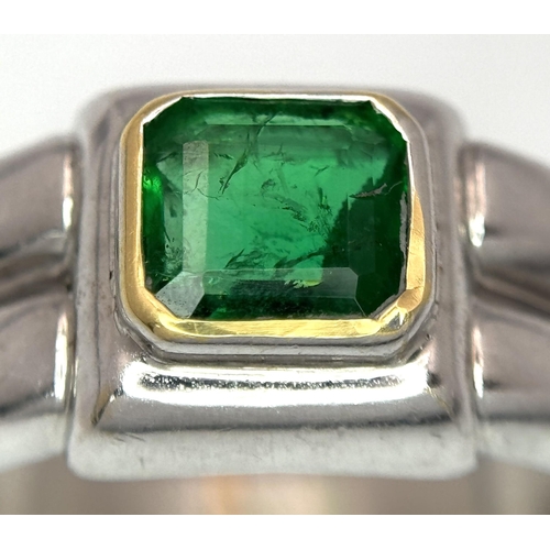 136 - A Princess Cut 0.75ct Mesmerising Emerald Set in a Platinum Ring. Size L 1/2. 14.6g total weight.