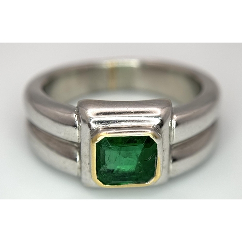 136 - A Princess Cut 0.75ct Mesmerising Emerald Set in a Platinum Ring. Size L 1/2. 14.6g total weight.