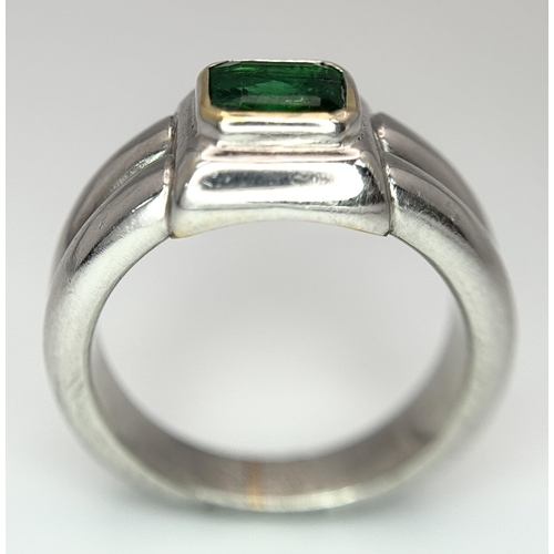 136 - A Princess Cut 0.75ct Mesmerising Emerald Set in a Platinum Ring. Size L 1/2. 14.6g total weight.