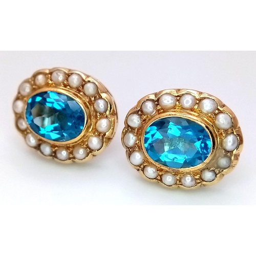 102 - A Pair of 18K Yellow Gold, Topaz and Seed Pearl Earrings. Two beautiful oval cut London Topaz with s... 