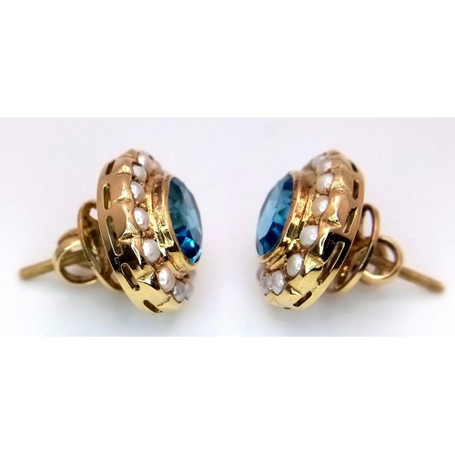 102 - A Pair of 18K Yellow Gold, Topaz and Seed Pearl Earrings. Two beautiful oval cut London Topaz with s... 