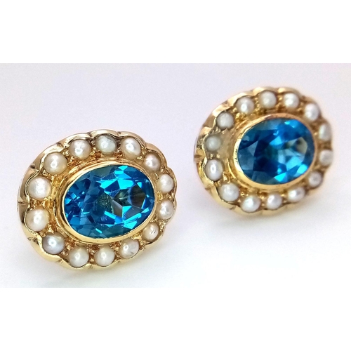 102 - A Pair of 18K Yellow Gold, Topaz and Seed Pearl Earrings. Two beautiful oval cut London Topaz with s... 