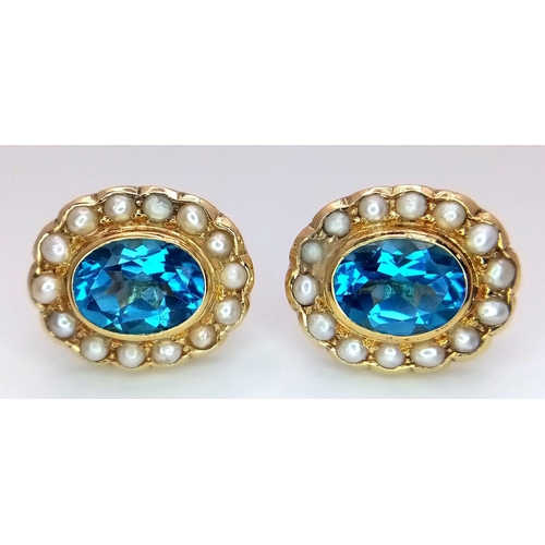 102 - A Pair of 18K Yellow Gold, Topaz and Seed Pearl Earrings. Two beautiful oval cut London Topaz with s... 