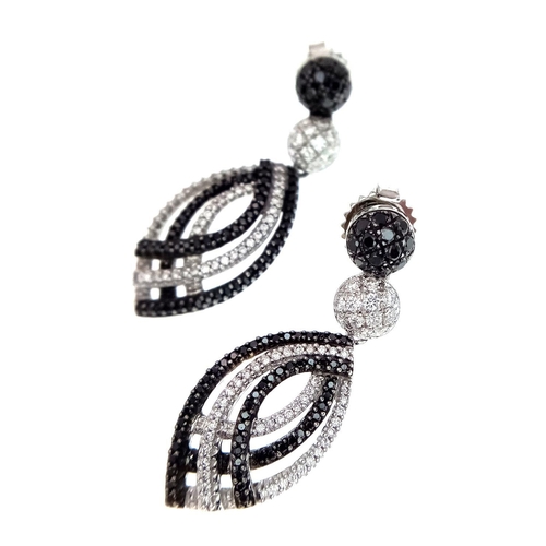 122 - A Stunning Pair of Black and White Diamond Drop Earrings - Set in 18K White Gold. Each earring havin... 