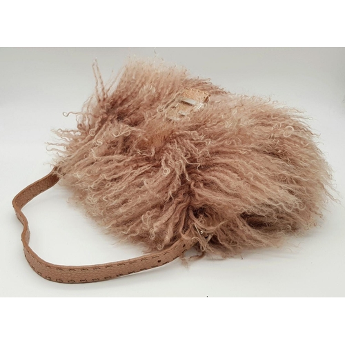 146 - A Fendi Pink Shearling Baguette Bag. Pink shearling exterior with silver-toned hardware and a single... 