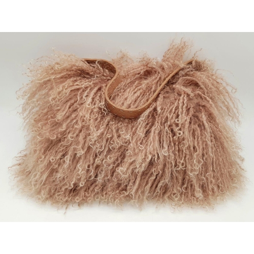 146 - A Fendi Pink Shearling Baguette Bag. Pink shearling exterior with silver-toned hardware and a single... 