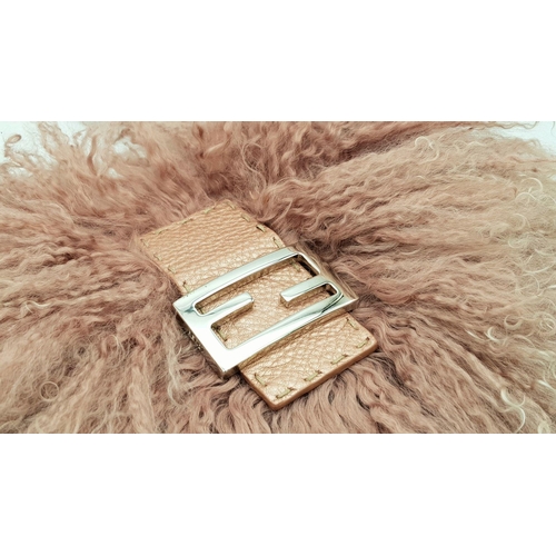 146 - A Fendi Pink Shearling Baguette Bag. Pink shearling exterior with silver-toned hardware and a single... 