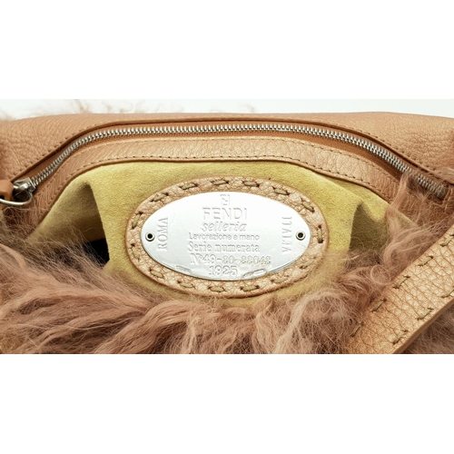 146 - A Fendi Pink Shearling Baguette Bag. Pink shearling exterior with silver-toned hardware and a single... 