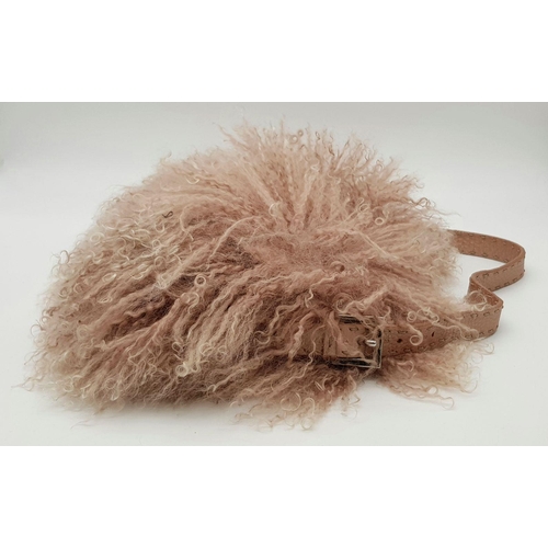 146 - A Fendi Pink Shearling Baguette Bag. Pink shearling exterior with silver-toned hardware and a single... 