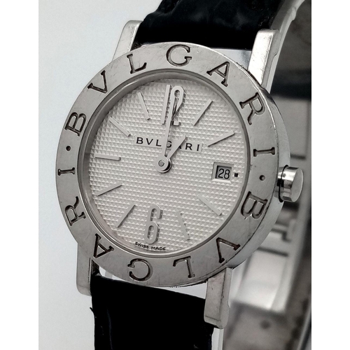 76 - A Bvlgari Quartz Ladies Watch. Black leather strap. Stainless steel case - 27mm. White dial with dat... 