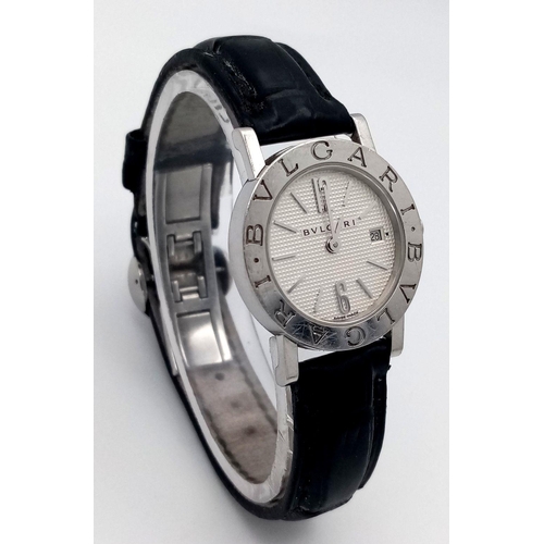 76 - A Bvlgari Quartz Ladies Watch. Black leather strap. Stainless steel case - 27mm. White dial with dat... 